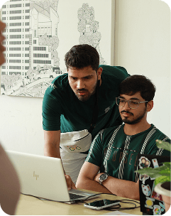 Two developers working at laptop